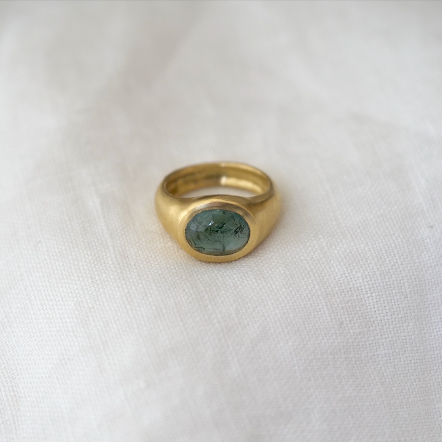 juicy blue-green tourmaline square cabochon is bezel set in 18K gold and is the perfect cocktail ring or everyday statement piece.