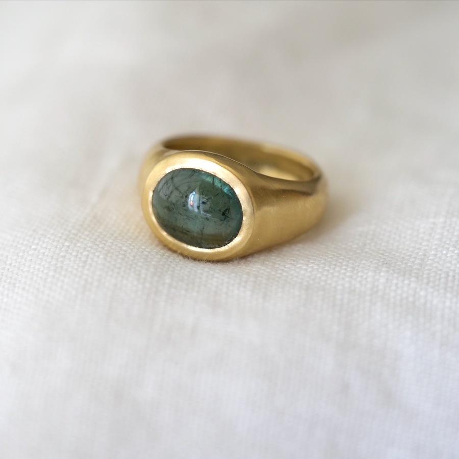 juicy blue-green tourmaline square cabochon is bezel set in 18K gold and is the perfect cocktail ring or everyday statement piece.