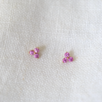 3 pink sapphires prong set in 14k gold on a gold post