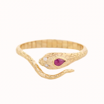 Gold Cobra Ring wraps around the finger, with the end of the tail meeting the head with its two white diamonds as eye and one ruby on its head. 