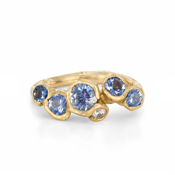 Five cornflower blue sapphires and one white diamond in organic 18k gold 