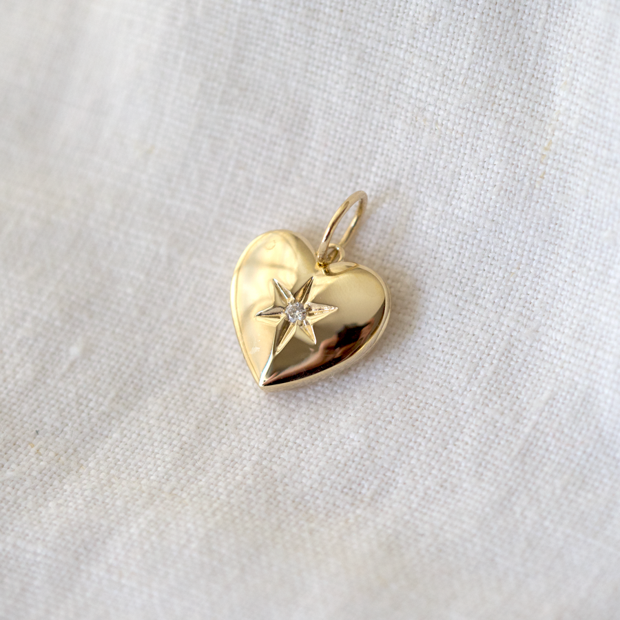 Vintage-inspired heart locket, Featuring a star set white diamond on the front