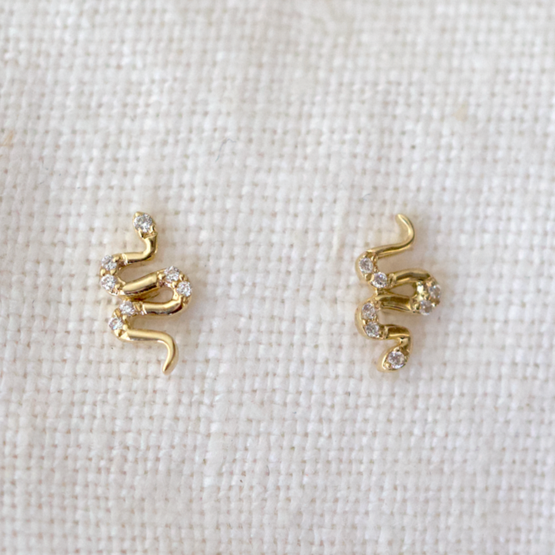 14k karat gold and studded with diamonds, these serpentine earrings add a touch of luxury