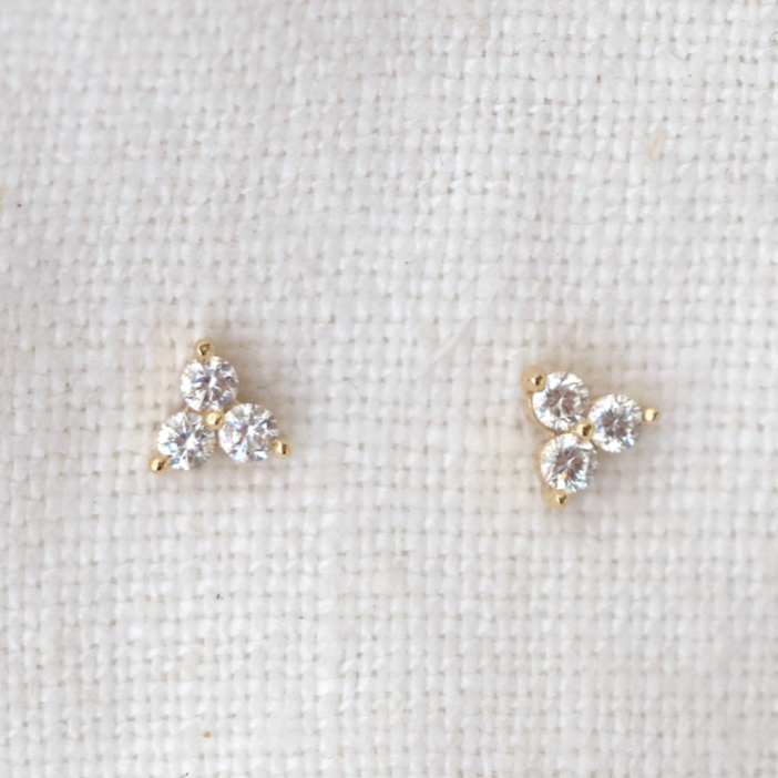 Three white diamonds bead set in the triangle 