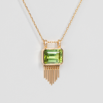 arge geometric tourmaline with the delicate fringe and diamond detailing 