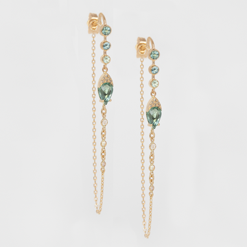 With the dew drops of blue green tourmaline, the shimmering diamond detailing and dripping chains these earrings are show stopping