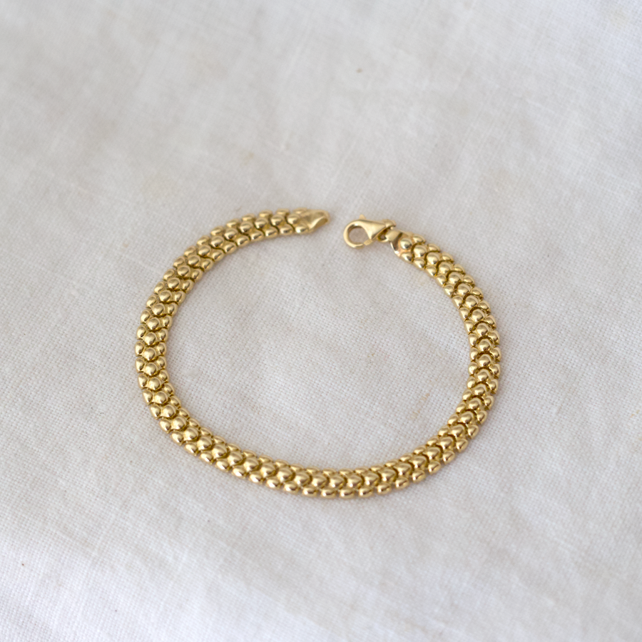 liquid, snake like chain link bracelet made of 14k gold