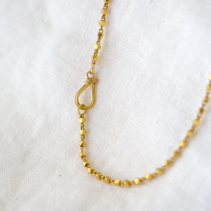 A rich 18k Indian necklace, featuring geometric 18k beads connected by sweet double-wire links.