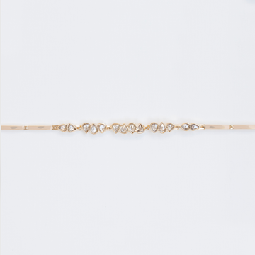 Each diamond in this bracelet has its own unique cut, color and shape- giving it a truly special feeling that can only come from being made by hand