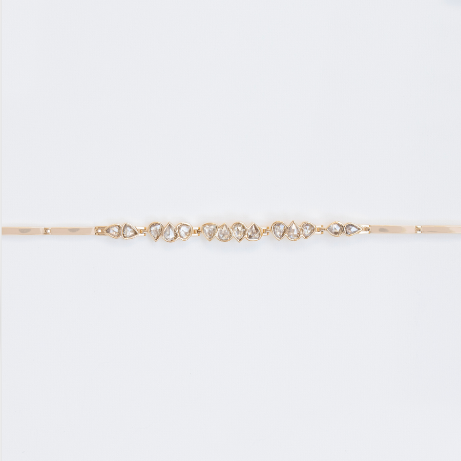 Each diamond in this bracelet has its own unique cut, color and shape- giving it a truly special feeling that can only come from being made by hand