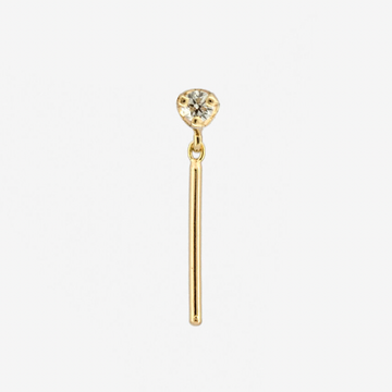 2mm prong-set stud with wisp of shimmery gold dangling below.
