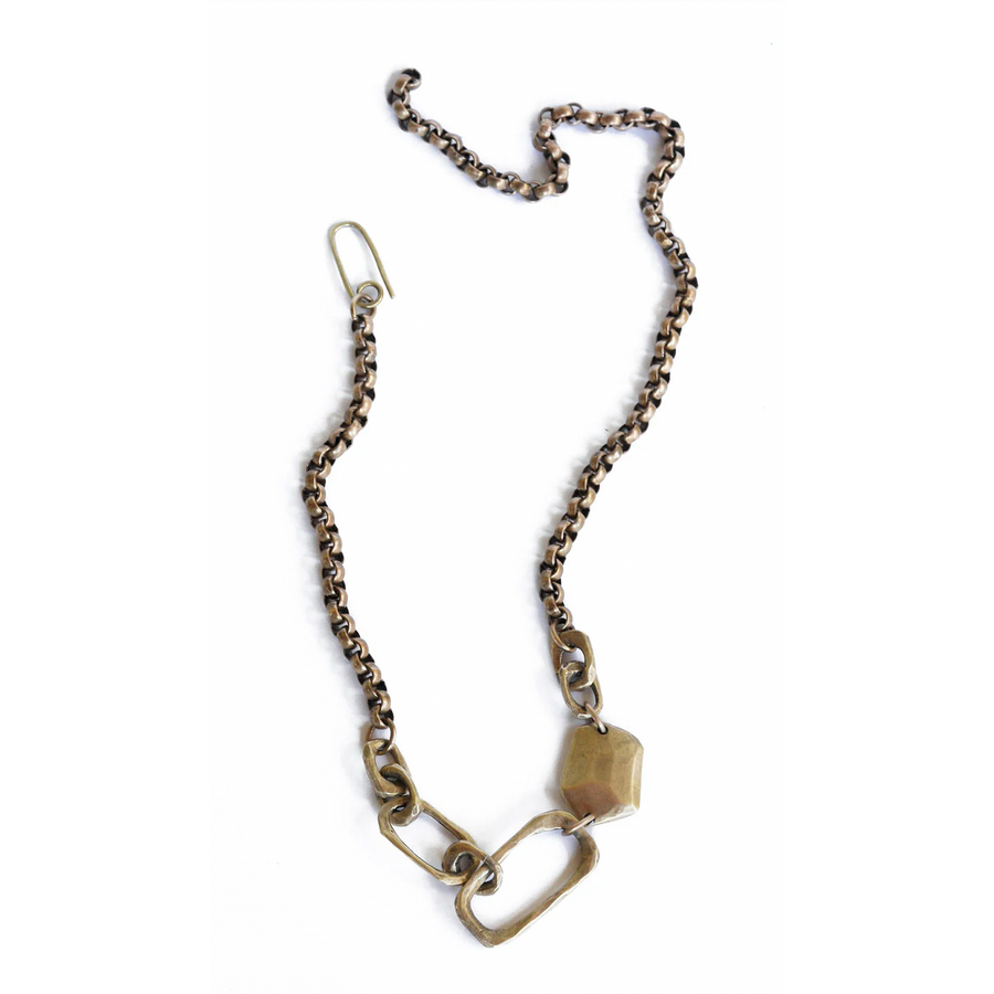 heavy brass chain with two large brass links and one brass stone shaped bead