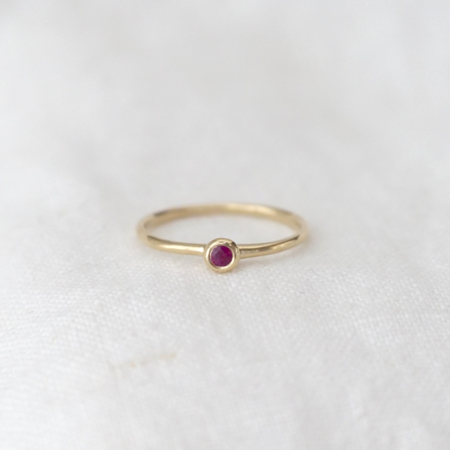 lightweight 14k gold band with a gorgeous 2.5mm Brilliant Cut Ruby