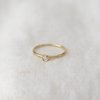 3 of 5: lightweight 14k gold band with a gorgeous 2.5mm white diamond bezel set in the center