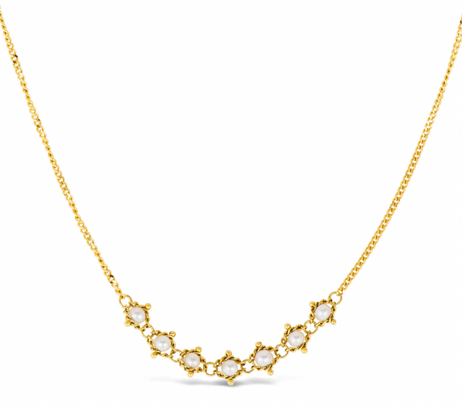 Seven Pearl treasures glisten at the center of this necklace. They have been carefully hand woven with strands of 18k gold so that each one is encircled with a glowing halo