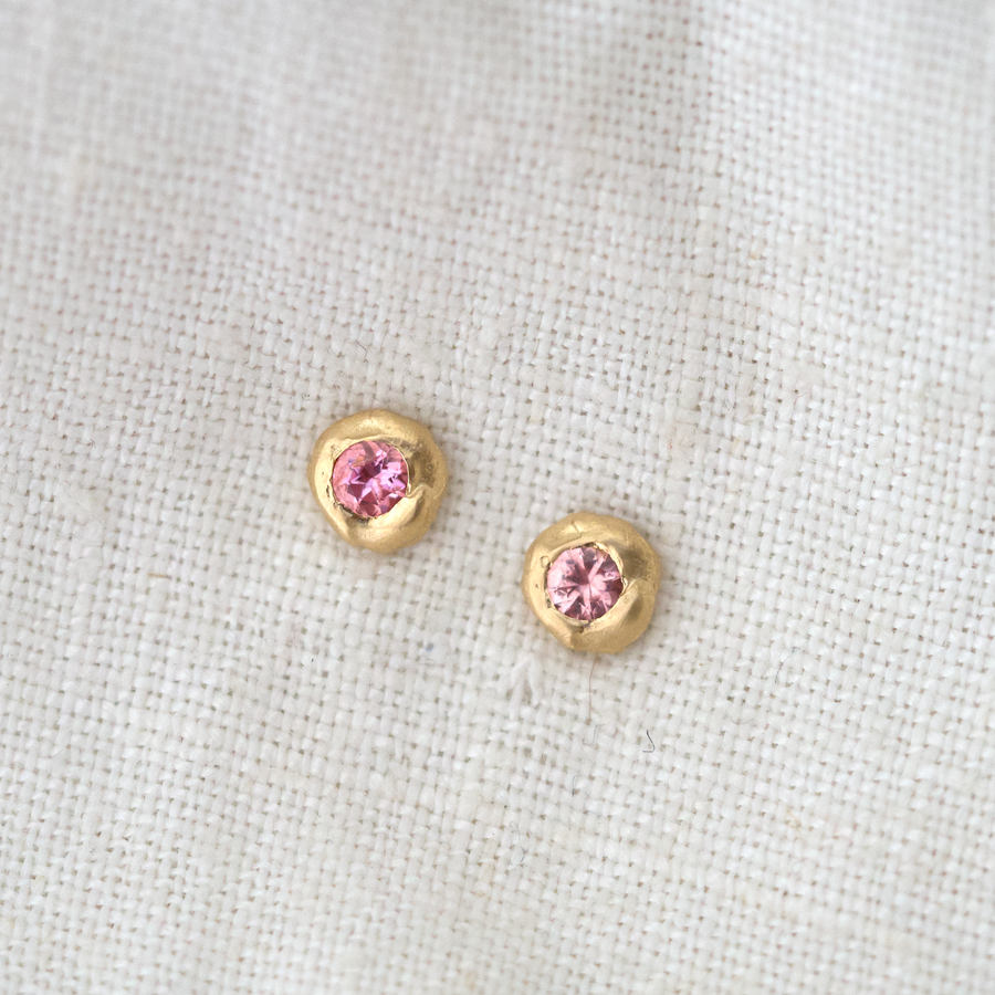 These little studs are organically shaped of gold with pink spinel flush set in the center