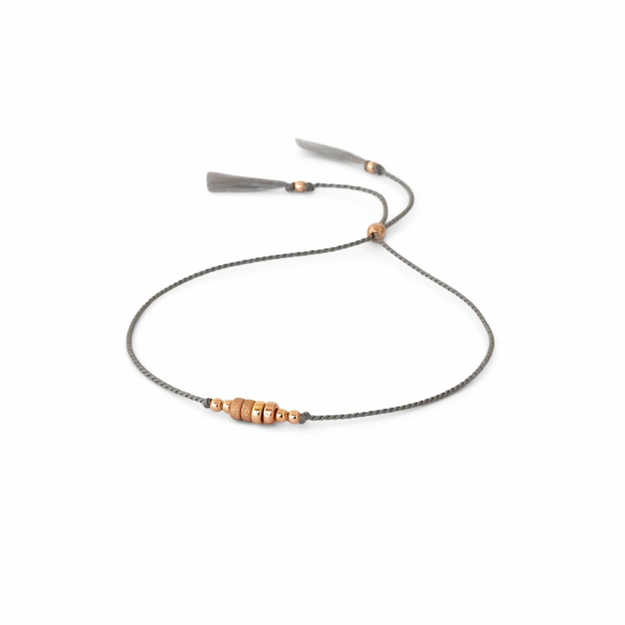 simple GREY silk cord bracelet adorned with smooth and shimmery textured 14k rose gold-filled beads.