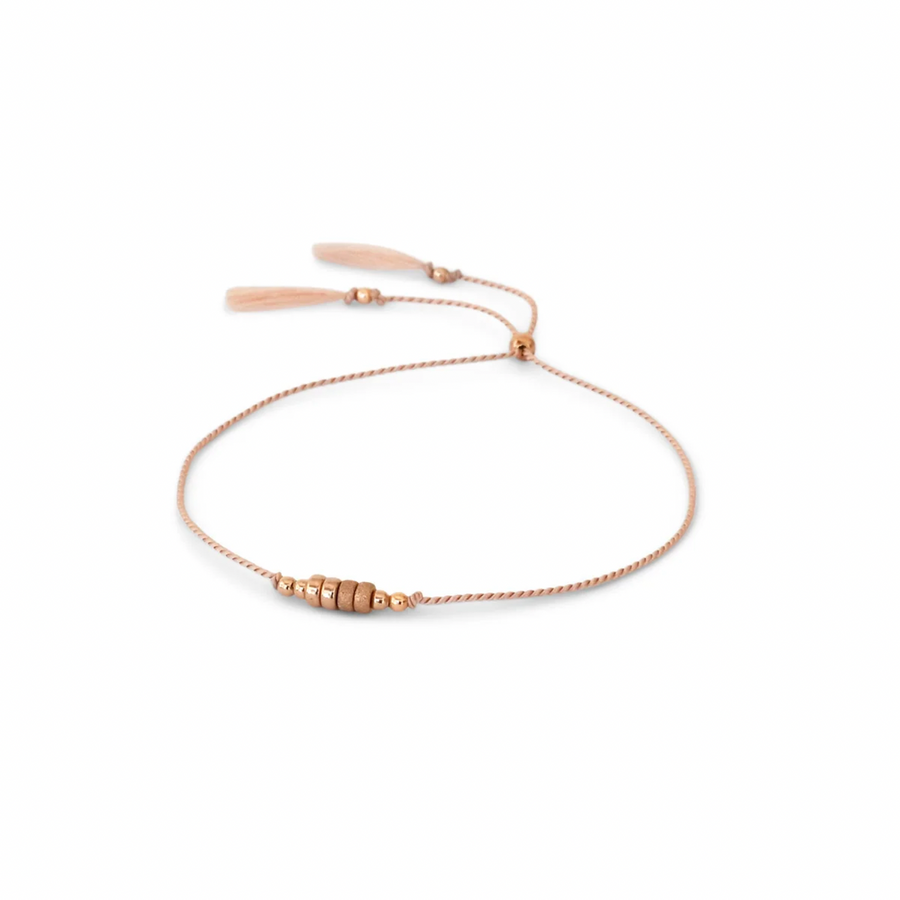 simple PINK silk cord bracelet adorned with smooth and shimmery textured 14k rose gold-filled beads.