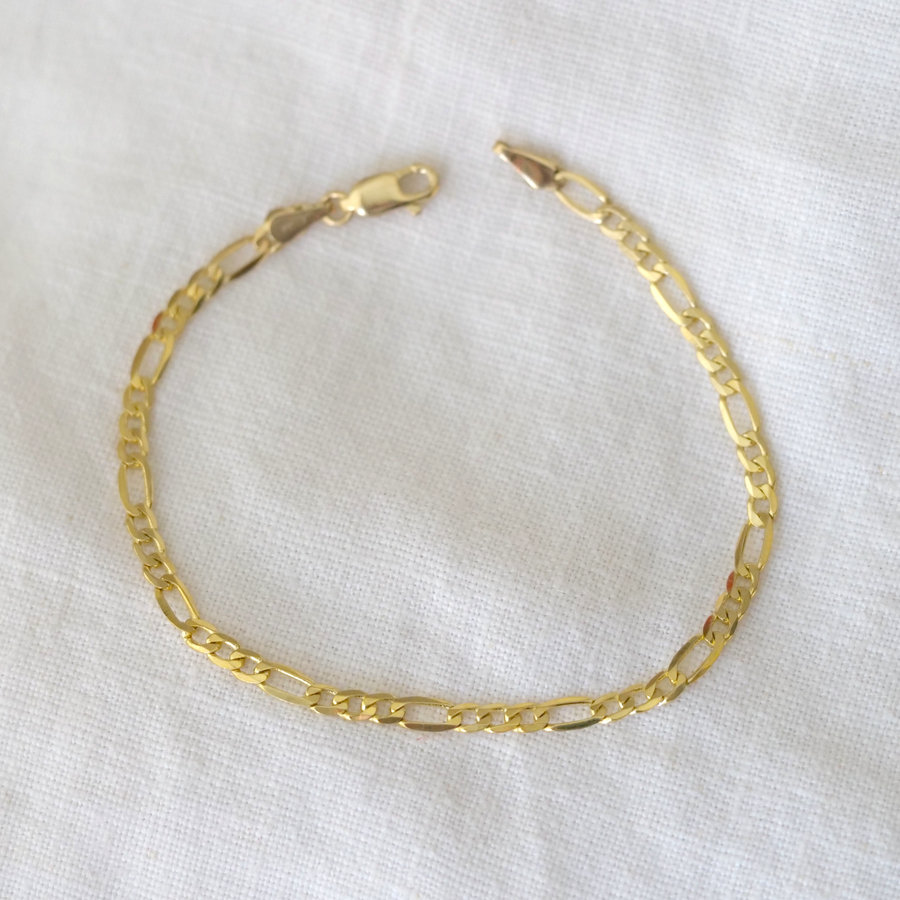 A 14K gold Figaro chain bracelet with a lobster clasp, displayed on a white background.