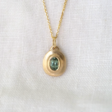 teal Tourmaline set in 14KY bezel set natural texture pendant