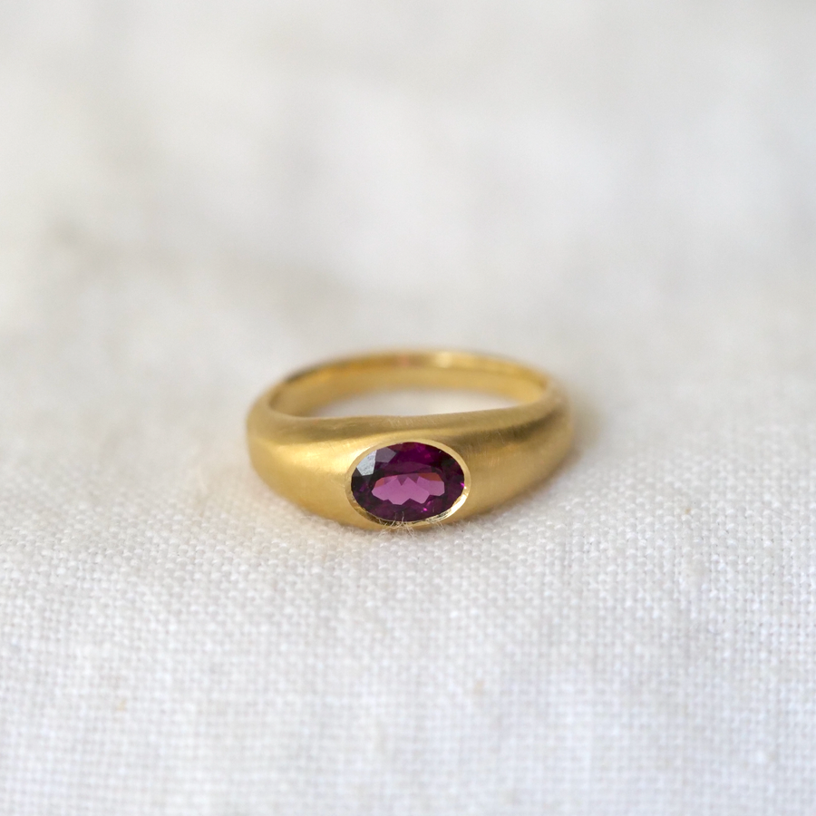 This rich Indian garnet is bezel set in our new and improved Helena band, a 