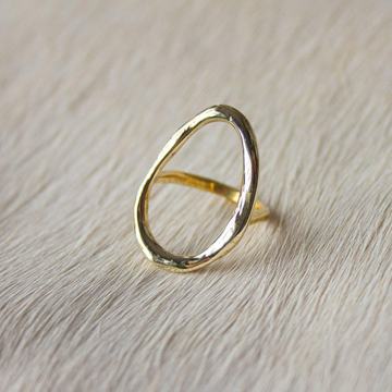 brass ring with open oval face, make of thick organic brass