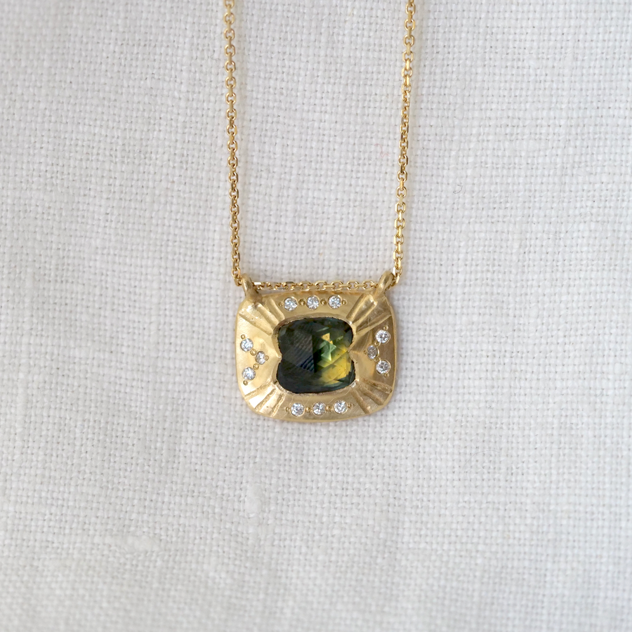  Australian Parti blue green yellow sapphire set in 18K yellow gold and accented with ethically sourced diamonds. 