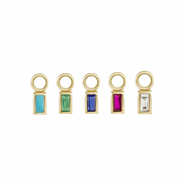 Set in a delicate 9ct yellow gold frame these baguette stone charms