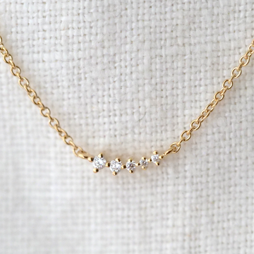 5 prong set diamonds in cascading size on a 14KY gold chain