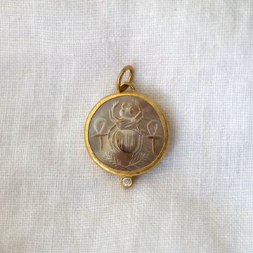 mother of pearl pendant, with a carved Intaglio image of a sacred scarab beetle