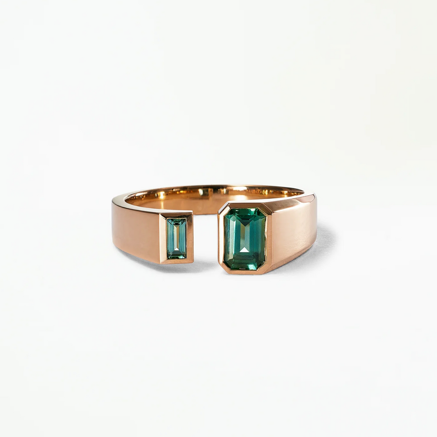 signet ring featuring bezel set teal sapphires that juxtapose each