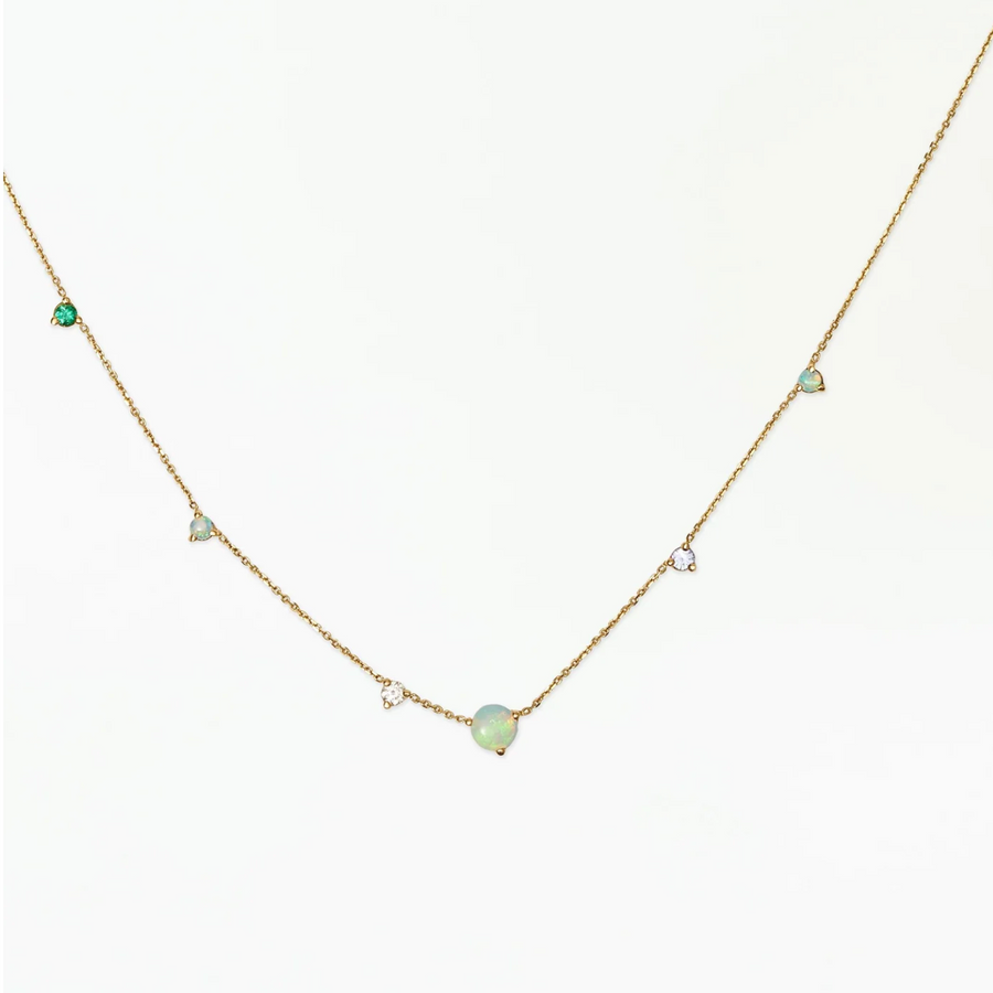 brilliant opals accented by sapphires, emeralds, and white diamonds set on a sparkling gold chain