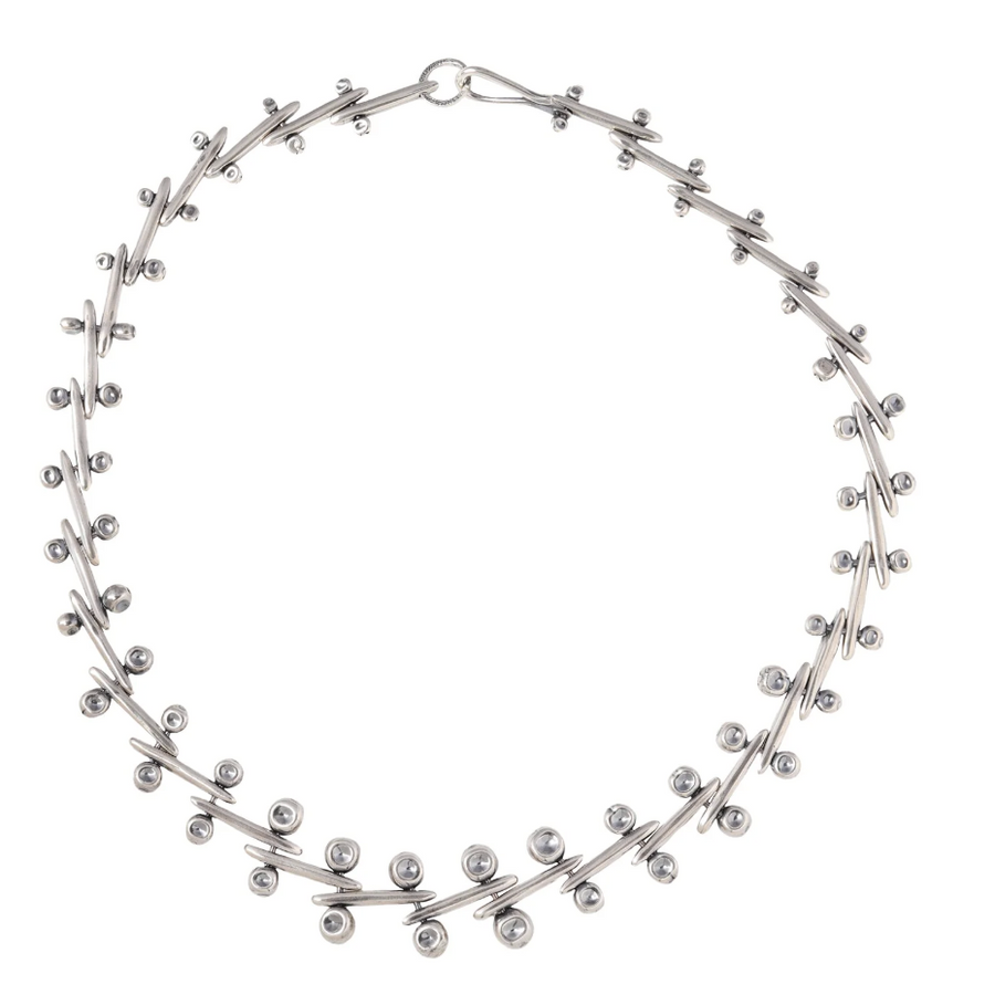unusual silver chain, made up of silver bars pierced with smaller silver posts and balls