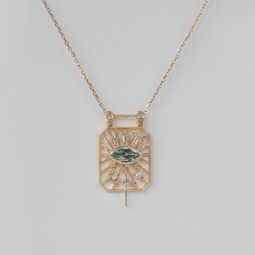 tourmaline 'eye' is surrounded by white diamonds suspended on dainty gold spindles on a cut out dog tag pendant