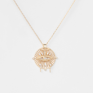 detailed eye medallion necklace in gold on white background
