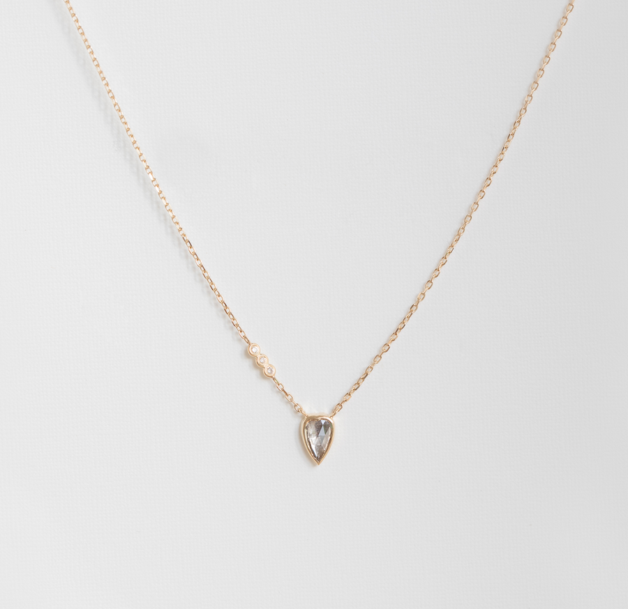 grey diamond heart and diamonds on 14K chain on white background