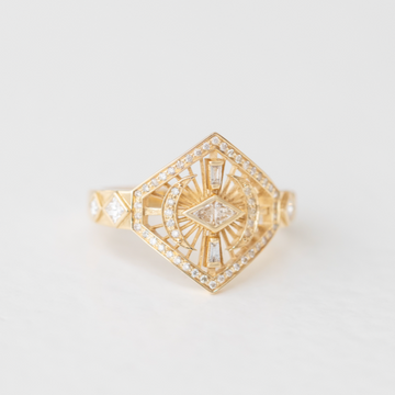 A spectacular geometric band featuring several unique cuts of diamonds, flanked by moons and set over a delicate spire pattern
