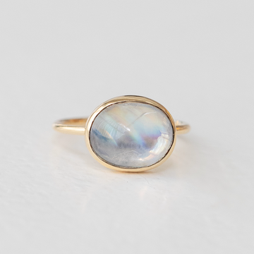 A radiant cabochon moonstone, set simply on a 14k band. 