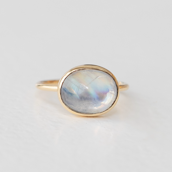 A radiant cabochon moonstone, set simply on a 14k band. 