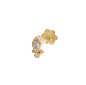 marquise diamond with small round diamond at the base and two small gold granulation balls