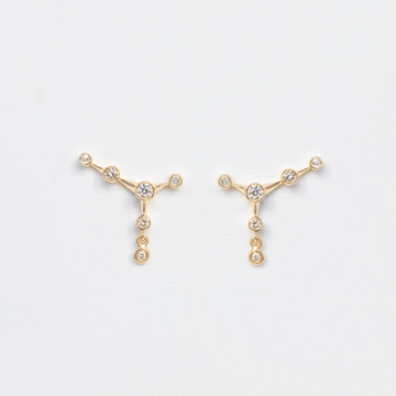 14K yellow gold with bezel set diamonds in a constellation setting 
