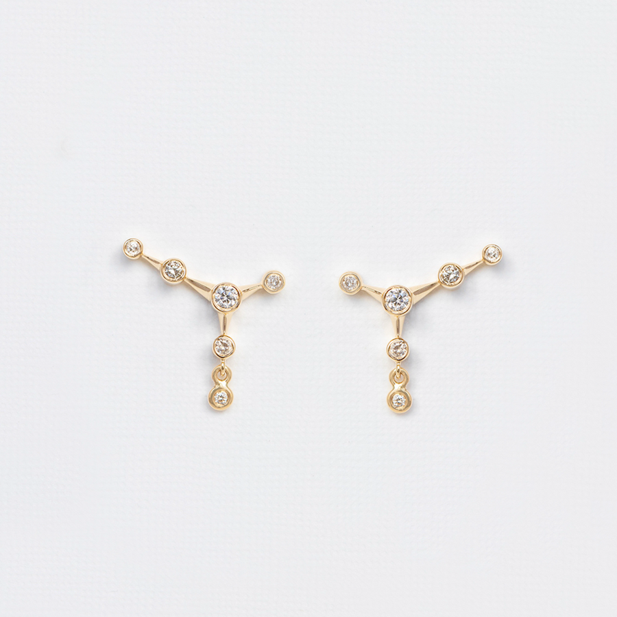 14K yellow gold with bezel set diamonds in a constellation setting 