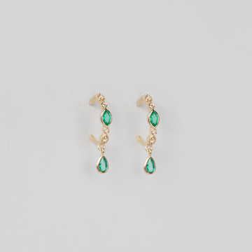 LIGHT YELLOW GOLD with Emerald Marquise and Pear cut dangling emeralds.