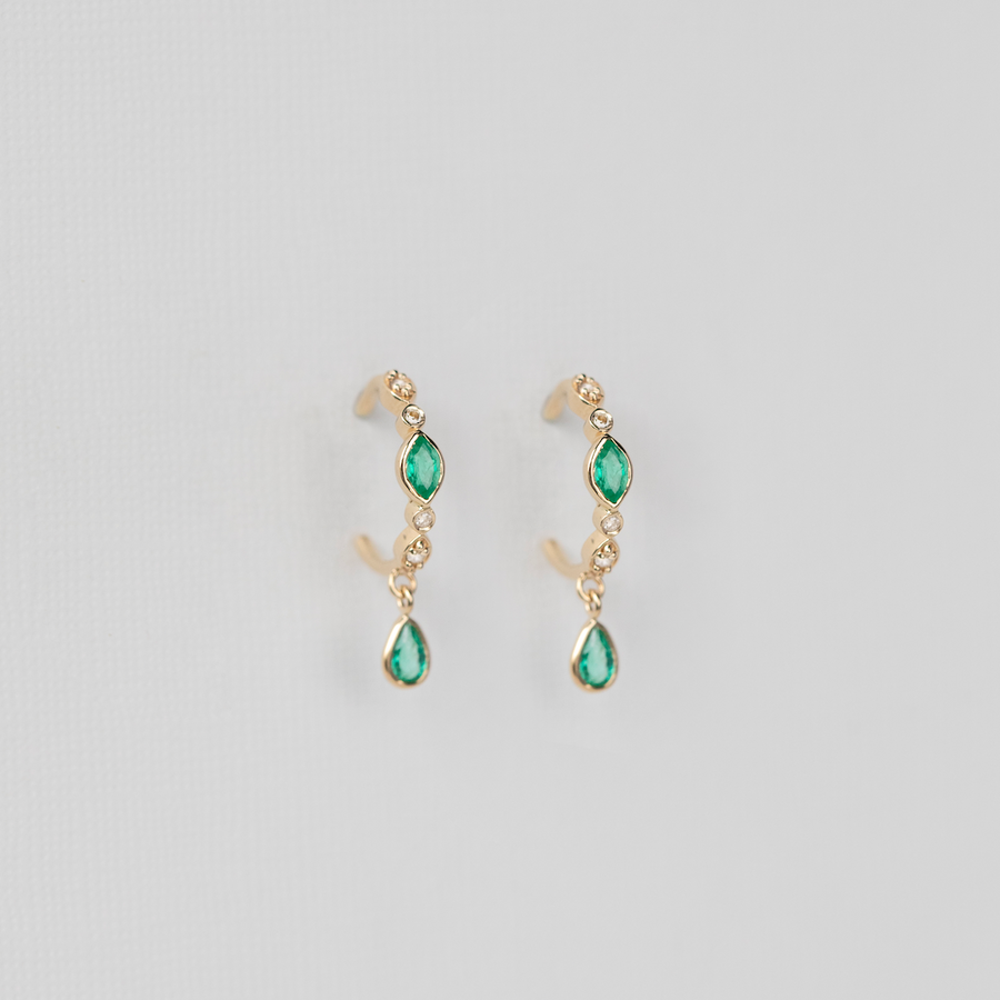 LIGHT YELLOW GOLD with Emerald Marquise and Pear cut dangling emeralds.