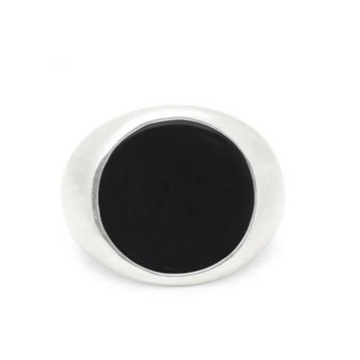 Cast from solid sterling silver set with a round slice of onyx, sitting flush to the skin