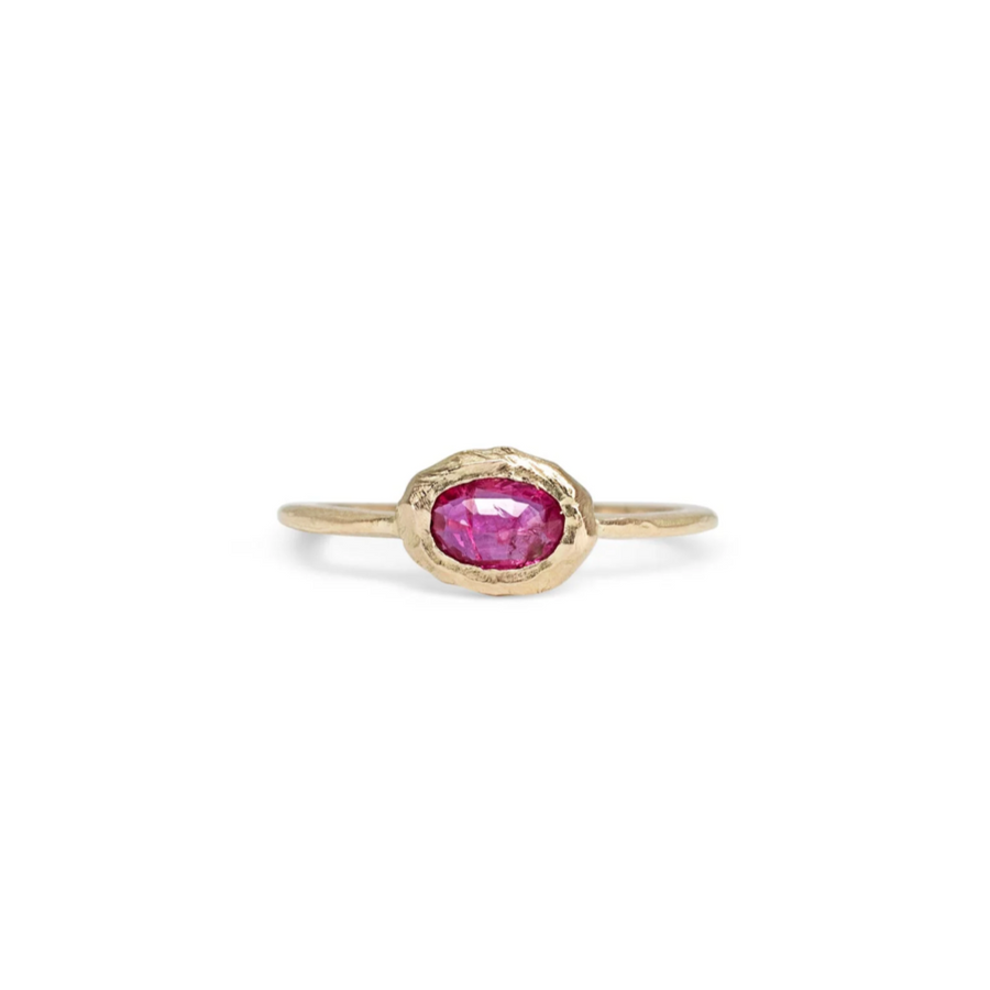 oval ruby set in 18k gold oval on an 18 karat yellow gold band