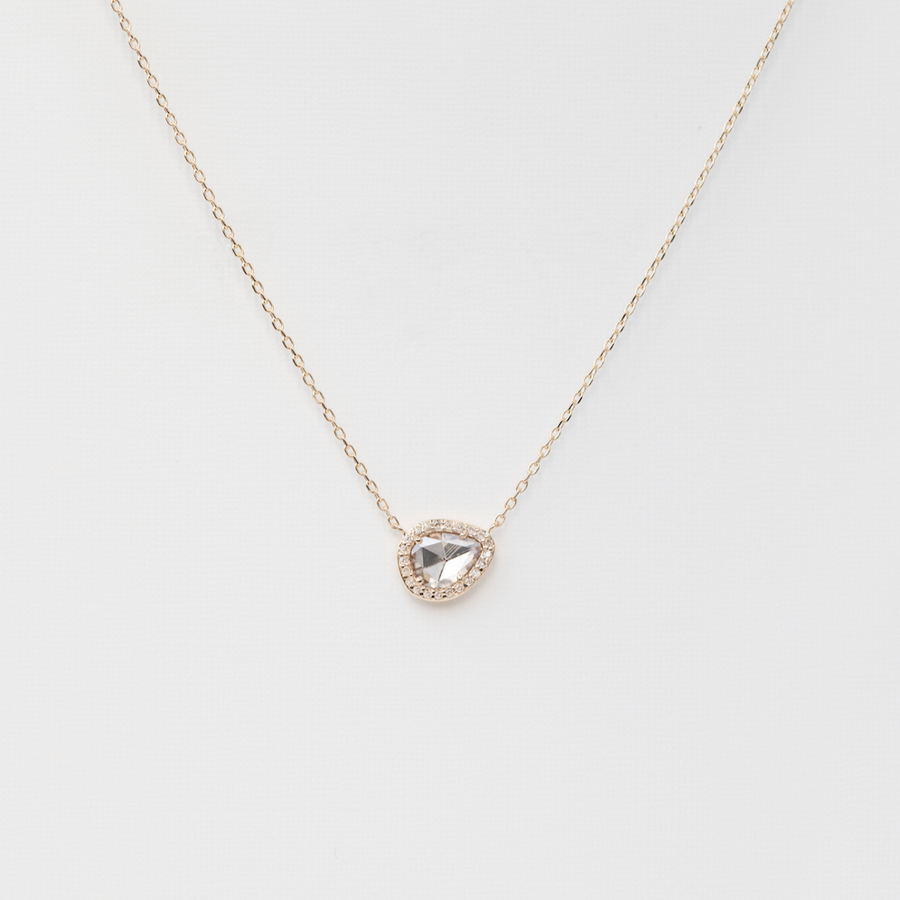 Necklace with a teardrop-shaped pendant on a light gray background