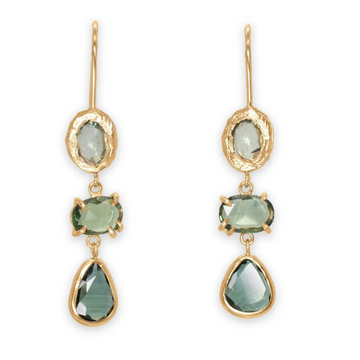 Gold earrings with green gemstones on a white background