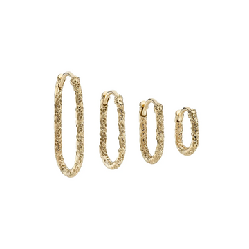 Set of gold hoop earrings on a white background