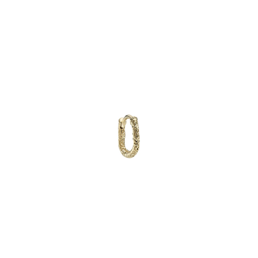 Gold hoop earring on a white background